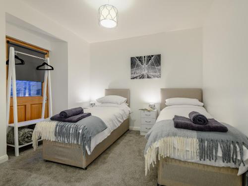 a bedroom with two beds and a window at 2 bed in Tintern 89323 in Tintern