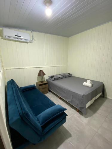 Casa em Balneário Camboriú tesisinde bir odada yatak veya yataklar