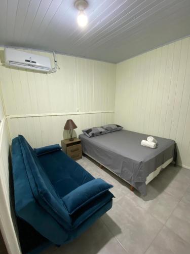 Ένα ή περισσότερα κρεβάτια σε δωμάτιο στο Casa em Balneário Camboriú