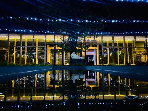 a building with lights in front of it at night at Leonera Hotel in La Leonera