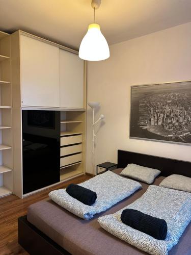 a living room with two beds in a room at City Center Apartment in Krakow