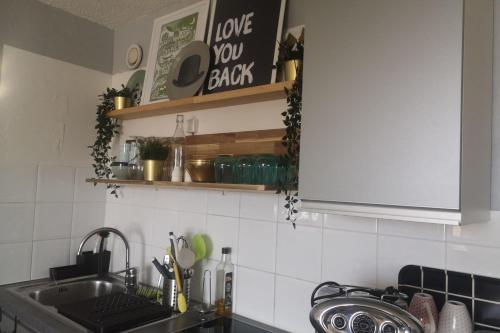 a kitchen with a sink and a counter top at The moon setting #AH5 in LʼHuez