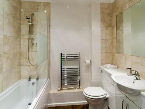 a bathroom with a toilet and a sink and a shower at Your Space Apartments - Market Rise in Cambridge