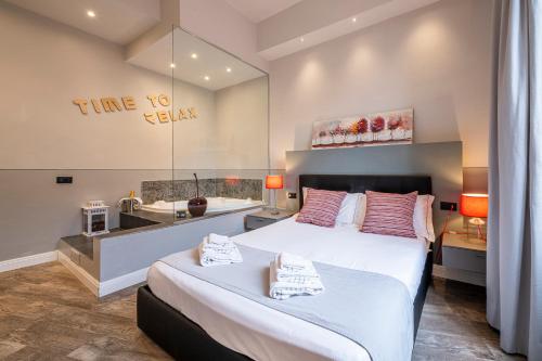 a hotel room with a bed and a sink at Cherubini Palace Thematic Apartment in Florence