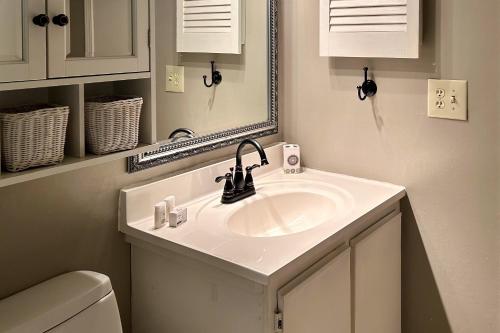 a bathroom with a sink and a mirror at Sea Cabin 228-B in Isle of Palms