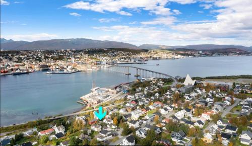 an aerial view of a city with a harbor at 1 roms leilighet sentralt in Tromsø