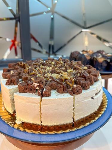 a cake sitting on top of a blue plate at Turia Granada in Granada