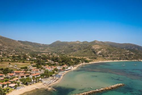 an aerial view of a beach with mountains in the background at Rosilion Studios & Apartments in Katelios