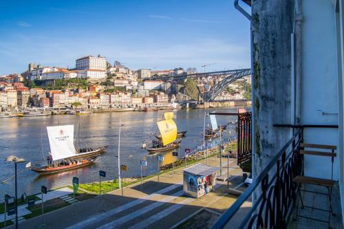 a view of a river with boats in the water at Riverside Oasis by LovelyStay in Vila Nova de Gaia