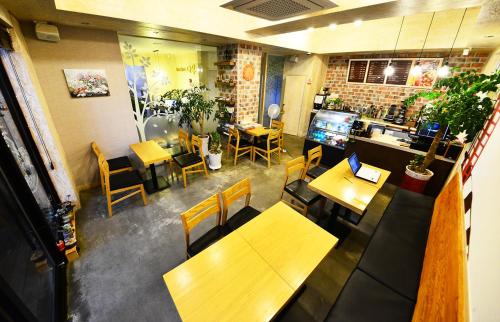 an overhead view of a restaurant with tables and chairs at Gyeongju Namu Guesthouse in Gyeongju
