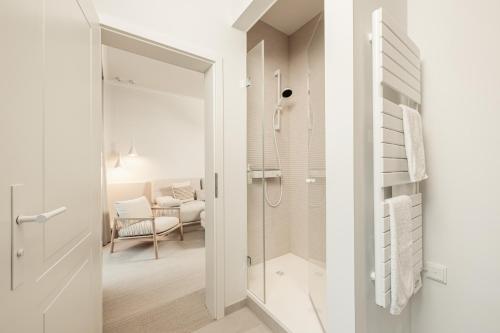 a bathroom with a shower and a glass door at Villa Astoria - Kühlungsborn in Kühlungsborn