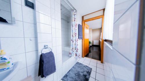 a small bathroom with a sink and a mirror at may-homestay-saar in Neunkirchen