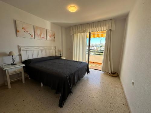 Кровать или кровати в номере bonito apartamento matalascañas