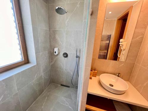 a bathroom with a shower and a sink at RAJ zdravia in Bratislava