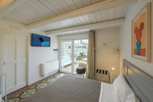 Ένα ή περισσότερα κρεβάτια σε δωμάτιο στο Murr Luxury Rooms