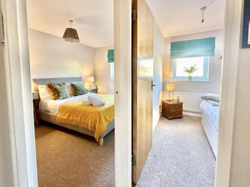 a bedroom with a bed and a window at Fewster Apartment - City Centre location with free parking in York