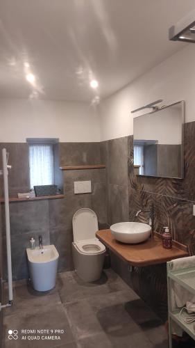 a bathroom with a toilet and a sink at AffittaCamere Columbus in Camogli