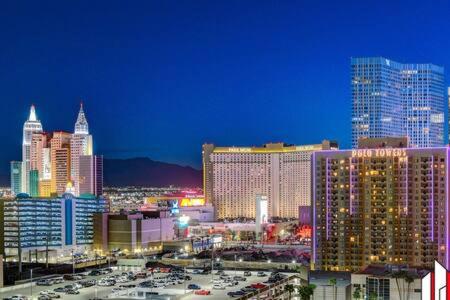 a view of a city at night with buildings at MGM Signature-15-717 F1 Track & Strip View Balcony in Las Vegas