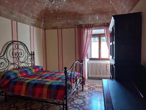Giường trong phòng chung tại Casa Marzocco
