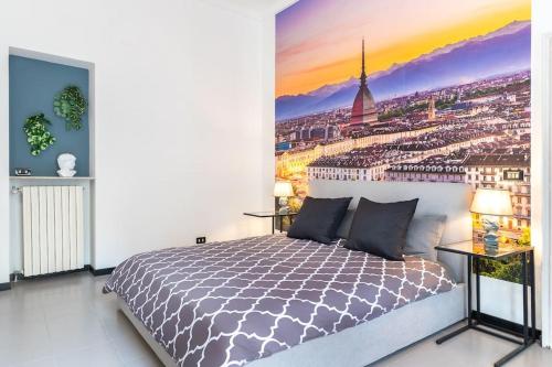 a bedroom with a bed with a view of a city at Historical suite - Pieno Centro - Porta nuova- Piazza Castello in Turin