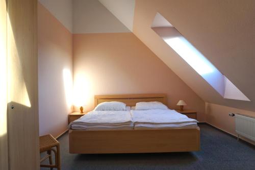 a bedroom with a bed in a attic at Ferienwohnung Ostseebrise, Schönberger Strand in Schönberger Strand
