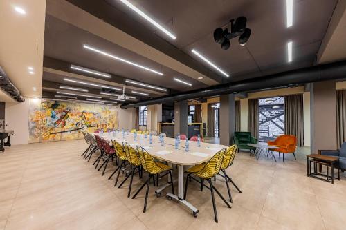 a large conference room with a long table and chairs at DiliJazz Hotel & Restaurant in Dilijan