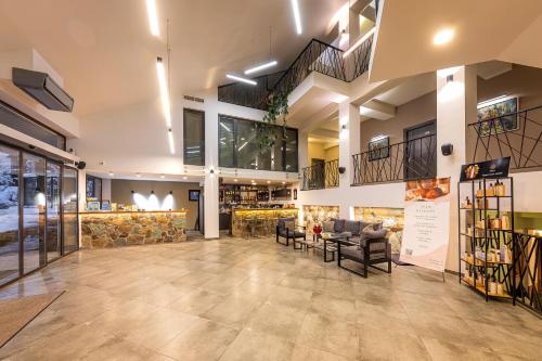 a lobby of a building with a store at DiliJazz Hotel & Restaurant in Dilijan