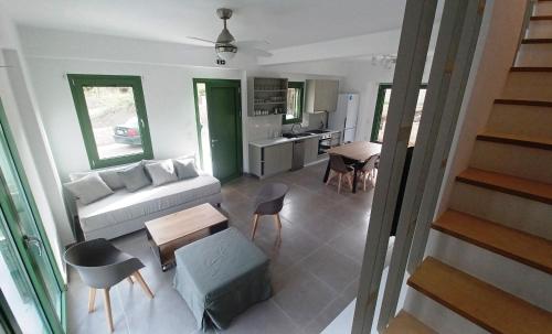 a living room with a couch and a table at MILIASIA in Kondáraina
