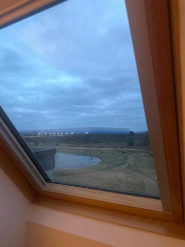 a window in a room with a view at ShowHomes in Broughton