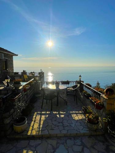 a patio with a table and a view of the ocean at Apartments Antigona Old Town in Ulcinj