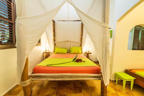 Postel nebo postele na pokoji v ubytování Martinique Treehouse