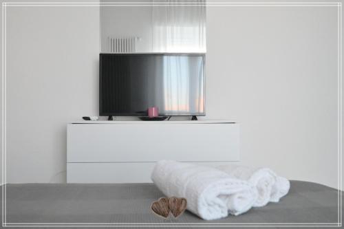 Televízia a/alebo spoločenská miestnosť v ubytovaní Casa Vivì
