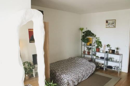 a bedroom with a bed in a room at Paris Skyview - Latin Quarter & Eiffel Tower in Paris