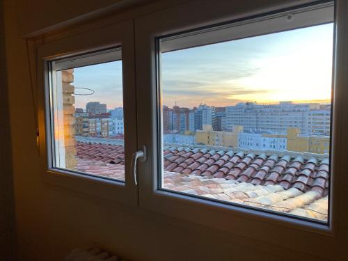 a window with a view of a city at Apartamento tranquilo en el centro de Burgos in Burgos