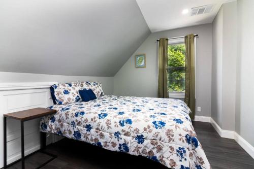 a bedroom with a bed and a window at Cozy Micro apartment Sleeps 2-3, Minutes from Falls in Niagara Falls