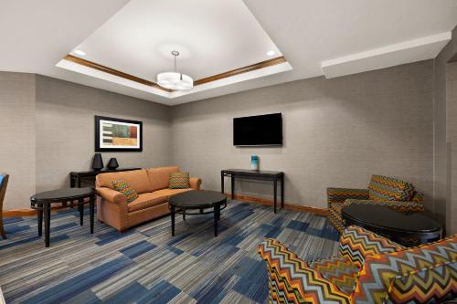 a waiting room with a couch and a tv at Holiday Inn Express Hotel & Suites Limon I-70/Exit 359 by IHG in Limon