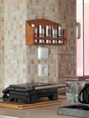 a kitchen with a toaster on a counter at Angels beach house in Rhodes Town