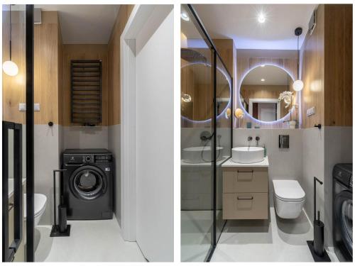 a bathroom with a washing machine and a washer at Lucky Seven No. 2 in Poznań
