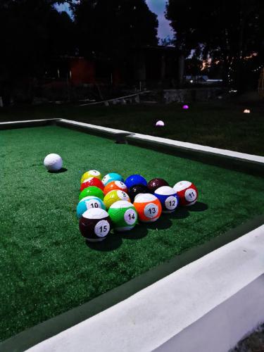 a group of balls sitting on the grass at Cabaña Círculo Mágico in San Miguel Regla