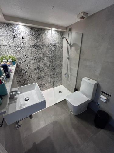 a bathroom with a shower and a toilet and a sink at Beautiful maisonette in Protaras in Protaras