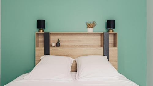 Ένα ή περισσότερα κρεβάτια σε δωμάτιο στο Appartement Spacieux - Disney