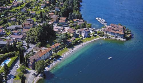 an aerial view of a resort on a beach at FORESTERIA GUESTHOUSE CA' DEI BACHITT in Lierna