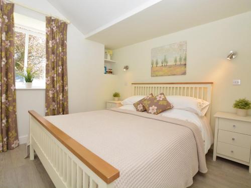 a bedroom with a white bed and a window at 2 Bed in Hilton 76519 in Tutbury