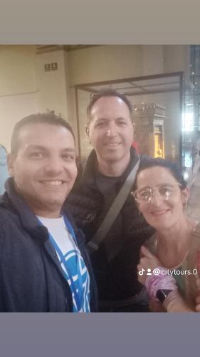 two men and a woman posing for a picture at Sooly pyramids Inn in Cairo