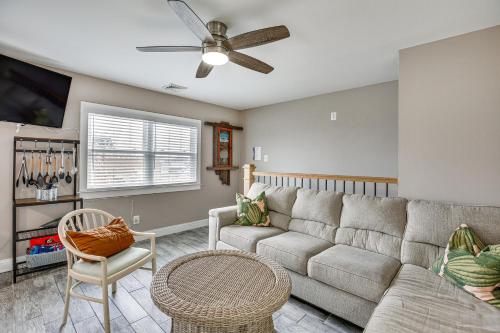 a living room with a couch and a ceiling fan at 1 Mi to Marina District! Bright Brigantine Condo in Brigantine