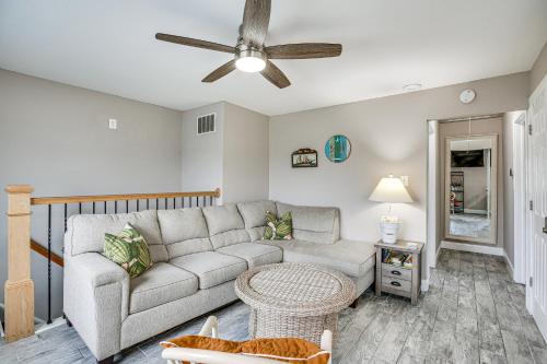 a living room with a couch and a ceiling fan at 1 Mi to Marina District! Bright Brigantine Condo in Brigantine