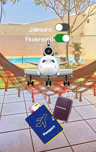 a drone with a sign on the ground at Aero Hostel in Londrina