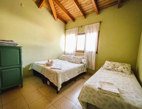 Una cama o camas en una habitación de Narciso Home