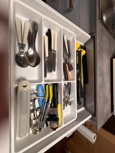 a drawer filled with utensils in a kitchen at One Bedroom with mountain and garden view ground floor of Chalet Solaria in Zweisimmen