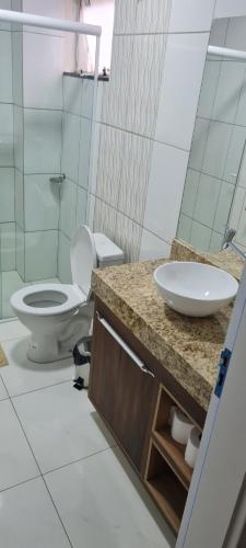 a bathroom with a sink and a toilet at Hotel em Timbo Grande 